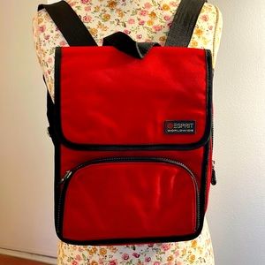 Esprit back pack with front snap closure. Zippered pocket in the front.